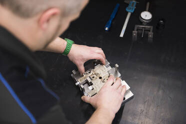 Man working on product in a factory - DIGF11422