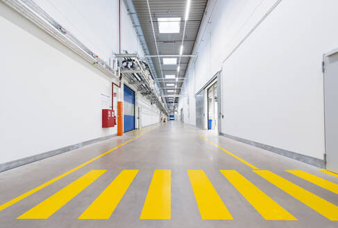 Long corridor in empty factory - DIGF11480