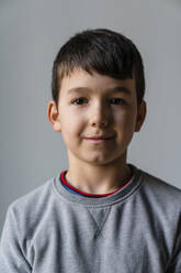 Close-up portrait of cute boy at home - MGIF00965