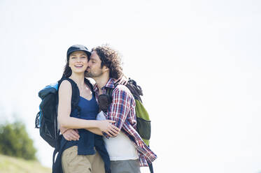 Hiking couple on meadow in summer, Wallberg, Bavaria, Germany - DIGF11674