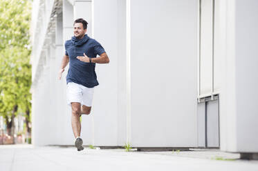 Young man jogging in the city - DIGF11801