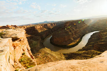 Morning light flare over a bend in the green river canyon in utah - CAVF82516