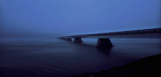 Bridge leading into thick fog in south east Iceland - CAVF82742