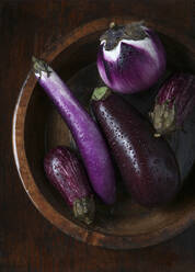 Eggplants in Wooden Bowl Wet with Droplets - CAVF82948