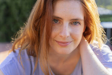 Portrait of redheaded woman looking at camera - AFVF06351