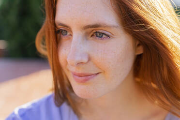 Portrait of redheaded woman looking sideways - AFVF06352