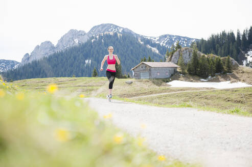 Female jogger, Wallberg, Bavaria, Germany - DIGF12341