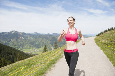 Female jogger, Wallberg, Bavaria, Germany - DIGF12348