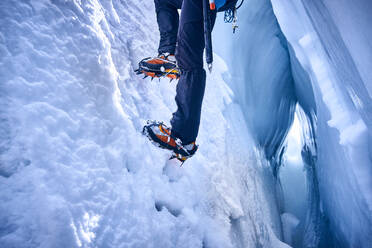 Mountaineer climbing in crevasse, Glacier Grossvendediger, Tyrol, Austria - PNEF02594