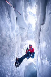Mountaineer climbing in crevasse, Glacier Grossvendediger, Tyrol, Austria - PNEF02596