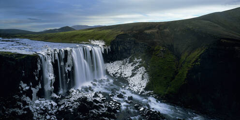 Unnamed half frozen waterfall in the Icelandic highlands - CAVF83390