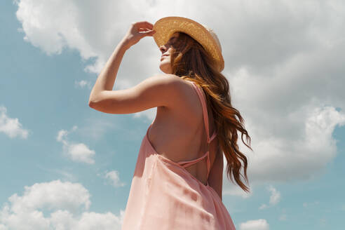 Portrait of redheaded woman enjoying sunlight - AFVF06372