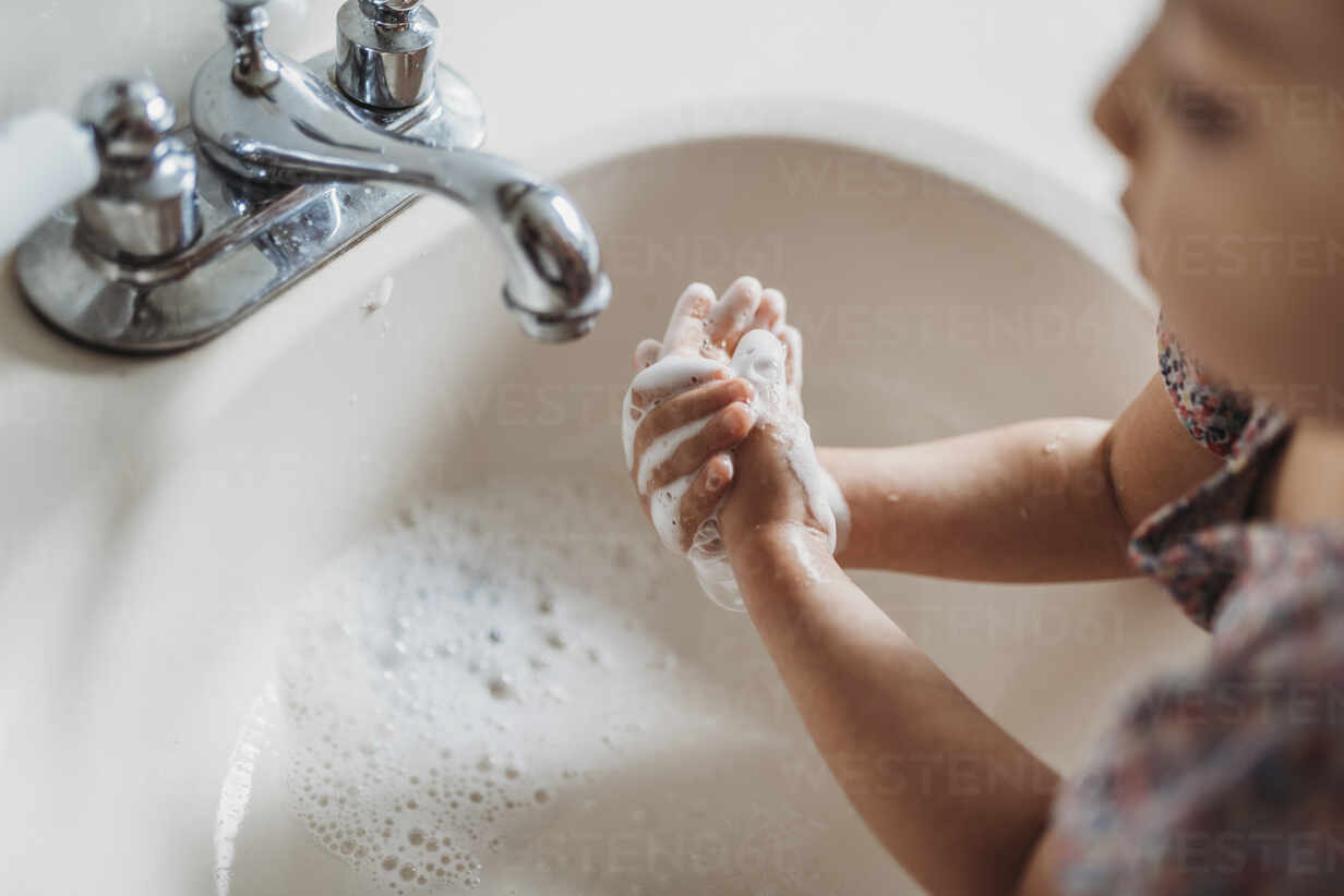 https://us.images.westend61.de/0001387768pw/high-angle-view-of-young-girl-washing-hands-in-sink-with-soap-CAVF83493.jpg