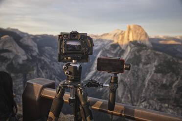 Filming and photographing half dome from glacier point - CAVF83549