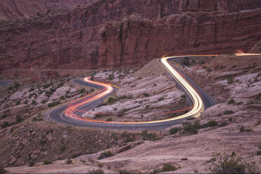 Car trails on the roads of Arches national park - CAVF83555