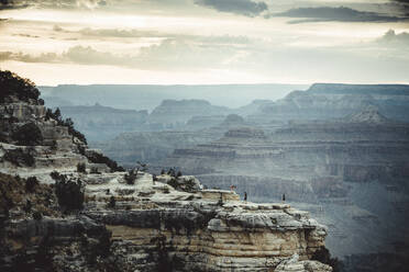 People over cliffs rocks in grand Canyon - CAVF83589