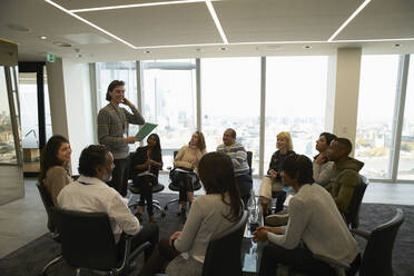 Business people meeting in circle in conference room - CAIF27532