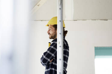 Pensive worker on a construction site - MJFKF00207
