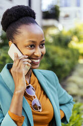 Portrait of happy young businesswoman on the phone - MFF05776