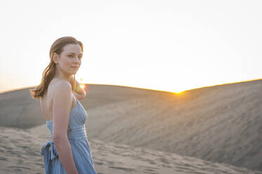 Portrait of woman at sunset in the dunes, Gran Canaria, Spain - DIGF12552