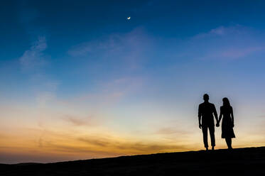 Couple at sunset in the dunes, Gran Canaria, Spain - DIGF12560