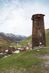 Georgia, Svaneti, Ushguli, Old brick tower overlooking medieval mountain village - WVF01748