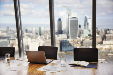 Modern highrise business conference room overlooking city - CAIF27748