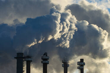 Smoke Stacks Pour Pollution Backlit by Sunrise - CAVF84157