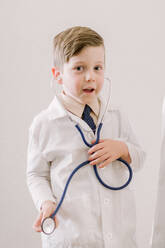 Young child in labcoat with stethoscope - CAVF84371