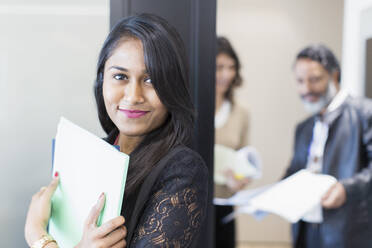 Portrait confident businesswoman standing outside meeting - CAIF28143