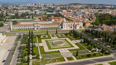 Aerial view of Jeronimos Monastery and Empire Square, on a partial sunny day, durind the pandemic Covid-19, in Lisbon, Portugal's capital. - AAEF08705