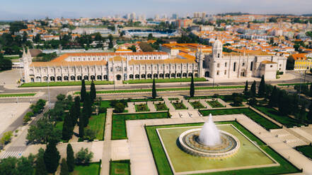 Aerial view of Jeronimos Monastery and Empire Square, on a partial sunny day, durind the pandemic Covid-19, in Lisbon, Portugal's capital. - AAEF08709