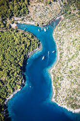 Aerial view of the bay shore with boats in Sumartin, Croatia - AAEF08804