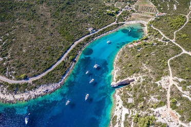 Aerial view of boats in Ex. Yugoslavian military shelter for submarines, Rogacic, Croatia - AAEF08813