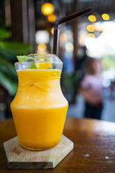Jug of orange juice with mint - GIOF08345