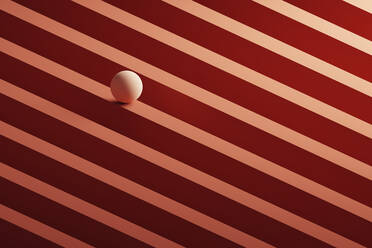Three dimensional render of small light brown sphere rolling over geometric pattern - DRBF00166