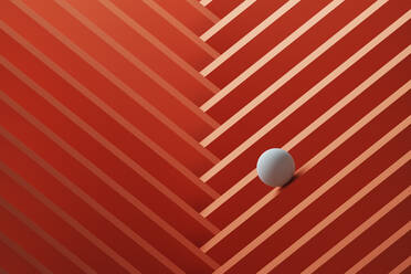 Three dimensional render of small white sphere rolling over geometric pattern - DRBF00169
