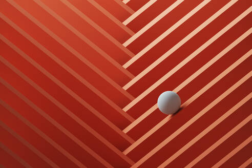 Three dimensional render of small white sphere rolling over geometric pattern - DRBF00169