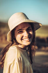 Happy young woman against clear sky during sunset - ACPF00741