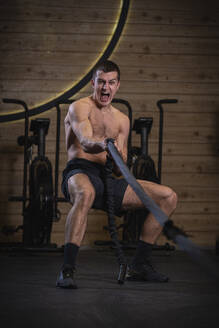 CrossFit athlete pulling rope - SNF00277