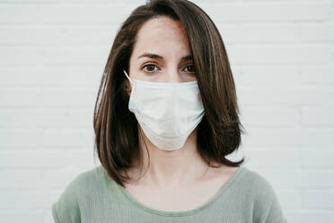 Portrait of woman wearing protective mask - EBBF00176