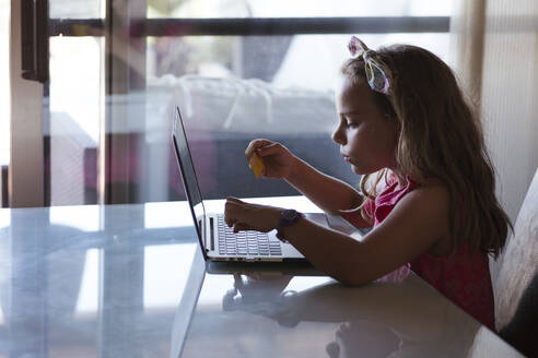 Girl using laptop at home - LJF01563