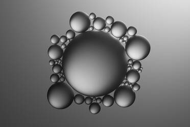 Glass spheres and dramatic lighting over dark grey background, 3D Illustration - DRBF00176
