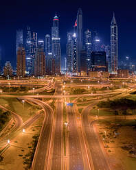 Aerial view of empty streets due to the coronavirus pandemic in Dubai during the night, United Arab Emirates - AAEF08938