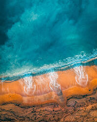 Aerial view of orange sand on the beach shore at Ringstead, Dorchester, UK - AAEF08950