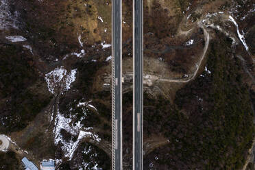 Aerial view of a bridge surrounded by snow in Anilio, Greece - AAEF09110