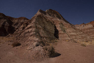 Striped Hillside in Paria Canyon Lands in Utah desert at night - CAVF84695