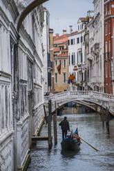 Gondola on narrow canal in Venice - CAVF84836