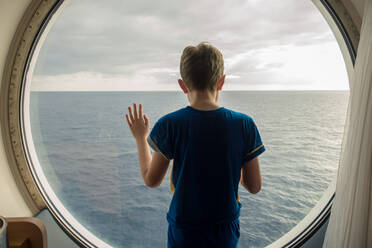 Boy Looking At Sea Against Sky - EYF05141