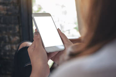 Midsection Of Woman Using Mobile Phone - EYF05319